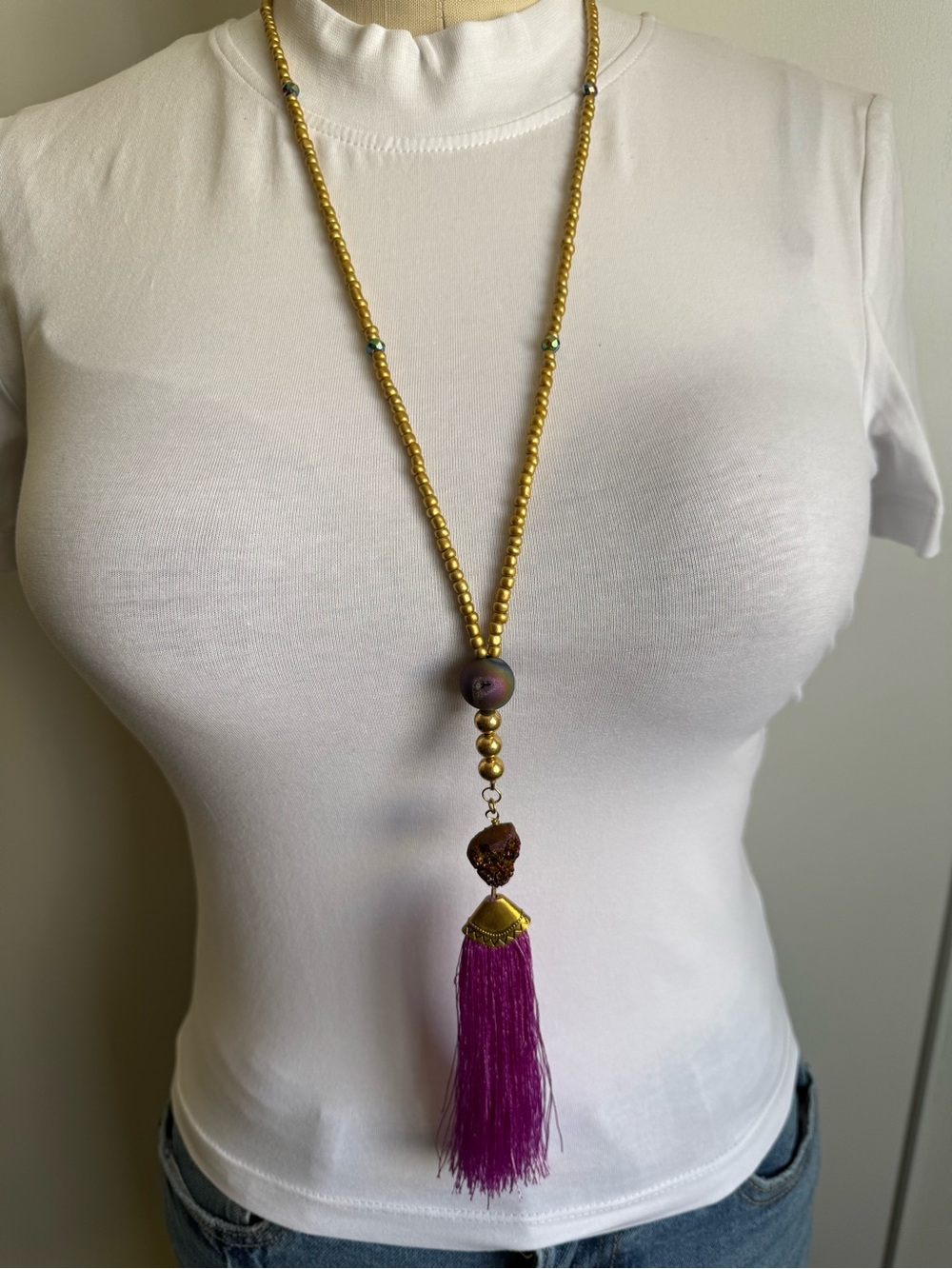 Handcrafted Gold Bead Necklace with Purple Tassel